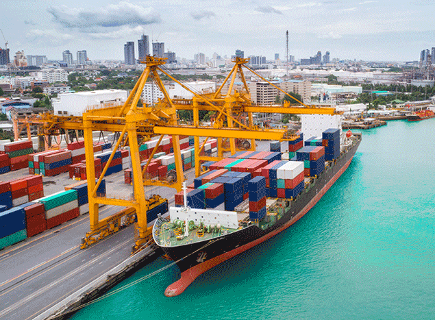 A docked cargo ship with cranes